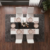 [4 Seater | White] White & Black Gloss 4-6 Seater Dining Table photographed from directly above with four white chairs and six blush place settings on a dark shag rug