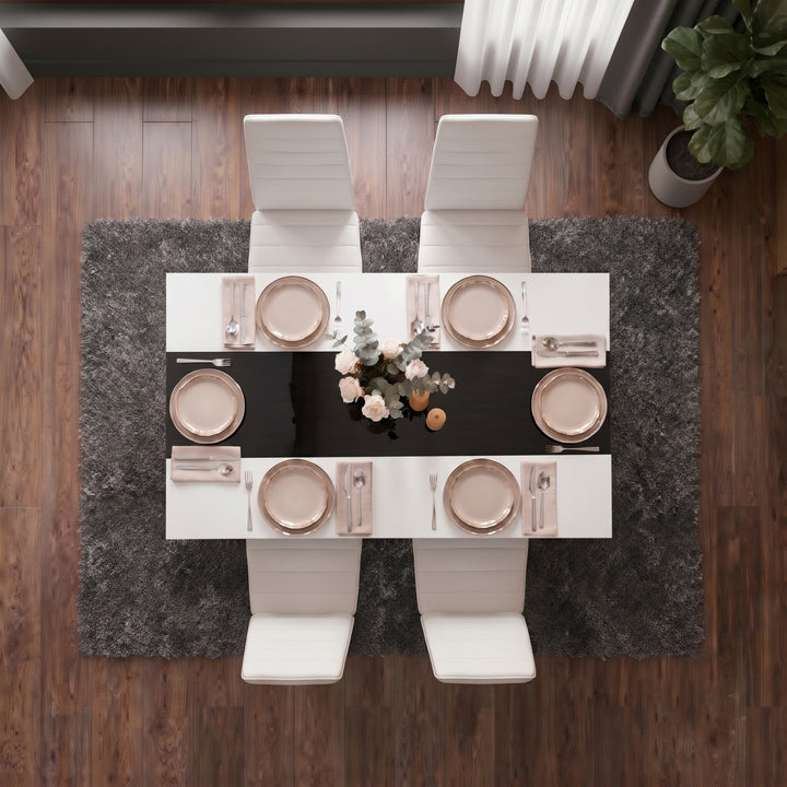 [4 Seater | White] White & Black Gloss 4-6 Seater Dining Table photographed from directly above with four white chairs and six blush place settings on a dark shag rug