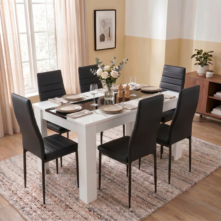 [6 Seater | Black] White & Black Gloss 4-6 Seater Dining Table styled with six black chairs, wine glasses and neutral tableware in a bright contemporary dining space