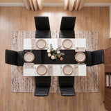 [6 Seater | Black] White & Black Gloss 4-6 Seater Dining Table seen from directly above with six black chairs and six beige place settings around a floral centrepiece