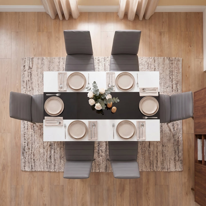 [6 Seater | Grey] White & Black Gloss 4-6 Seater Dining Table seen from directly above with six grey chairs, six beige place settings and a floral centrepiece