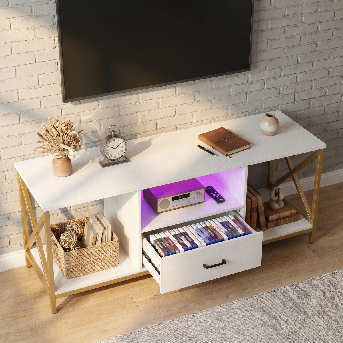 [White] Calvera TV unit overhead angle with drawer fully open revealing media storage and purple LED shelf lighting