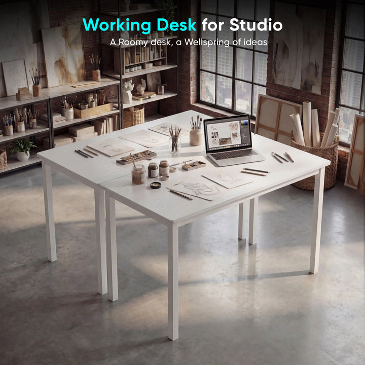 [100 x 50 cm] Home Office Desk 100cm in dark industrial studio setting with sketch drawings, pencils, paint jars, and laptop spread across the wide surface