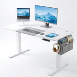 [120cm x 60cm] Electric Standing Desk Height Adjustable White Office Desk displaying a dual-screen workstation layout with a monitor, laptop on a stand, tablet, and side storage pouch accessories