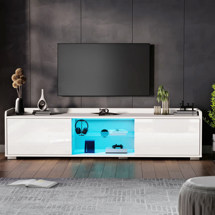 [White] High gloss white TV unit with two side cabinets and blue LED-lit central shelves below mounted TV