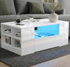 [White] High Gloss Coffee Table with LED angled living room showing blue LED central shelf, four-cube open side shelving with books