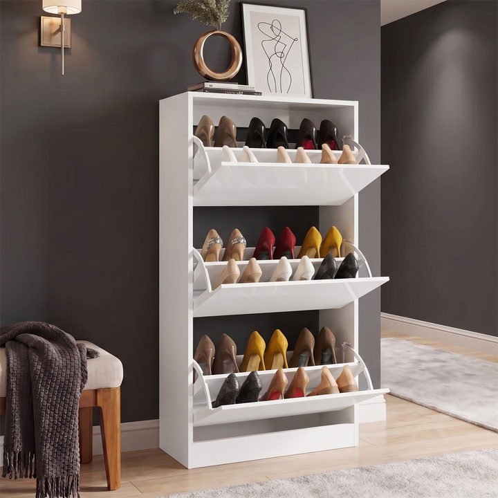 [White] High Gloss 3 Door Shoe Cabinet with all three compartments open displaying three tiers of heels in a dark hallway