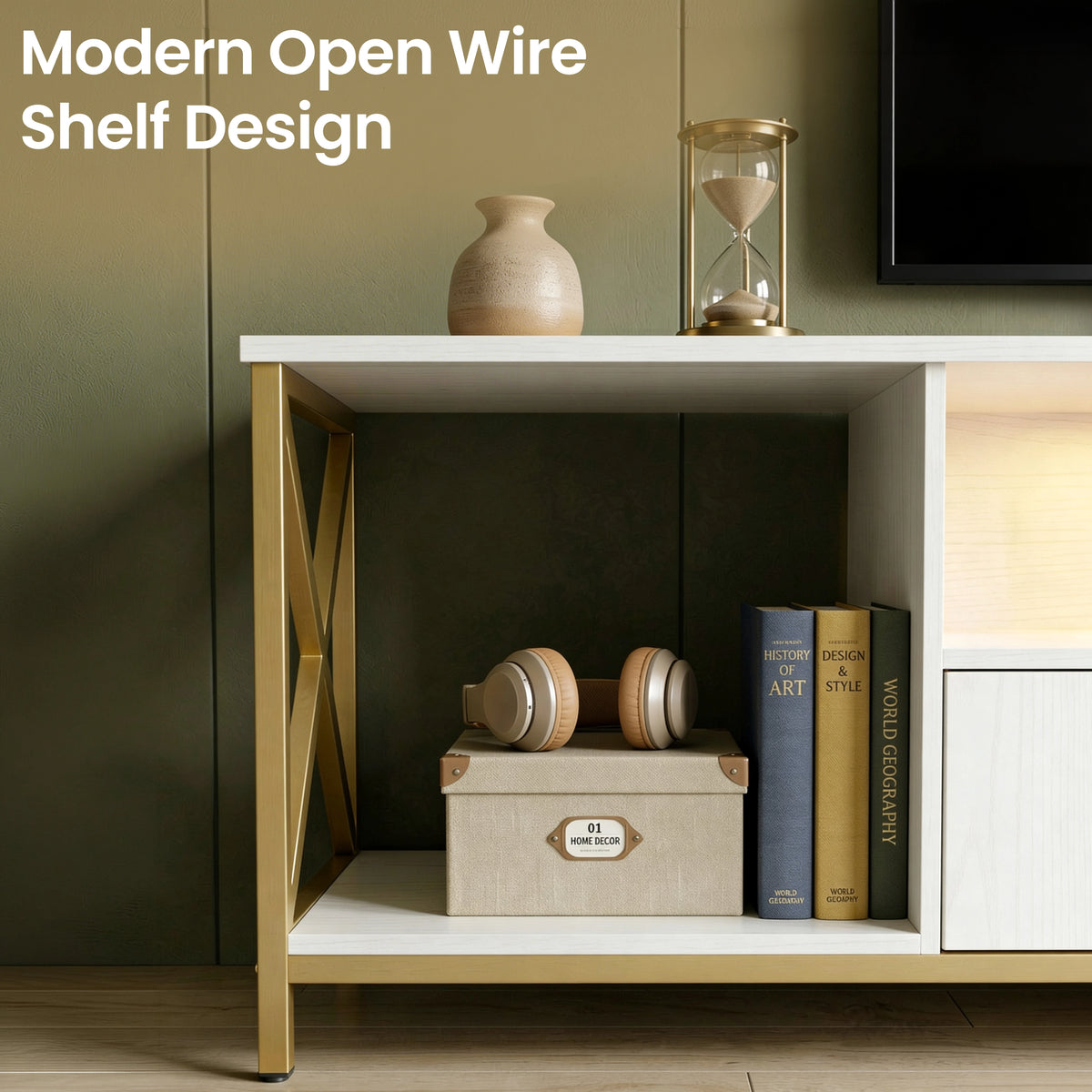 [White] Calvera TV stand open wire shelf detail, storage box and books inside, gold X-frame, vase and hourglass