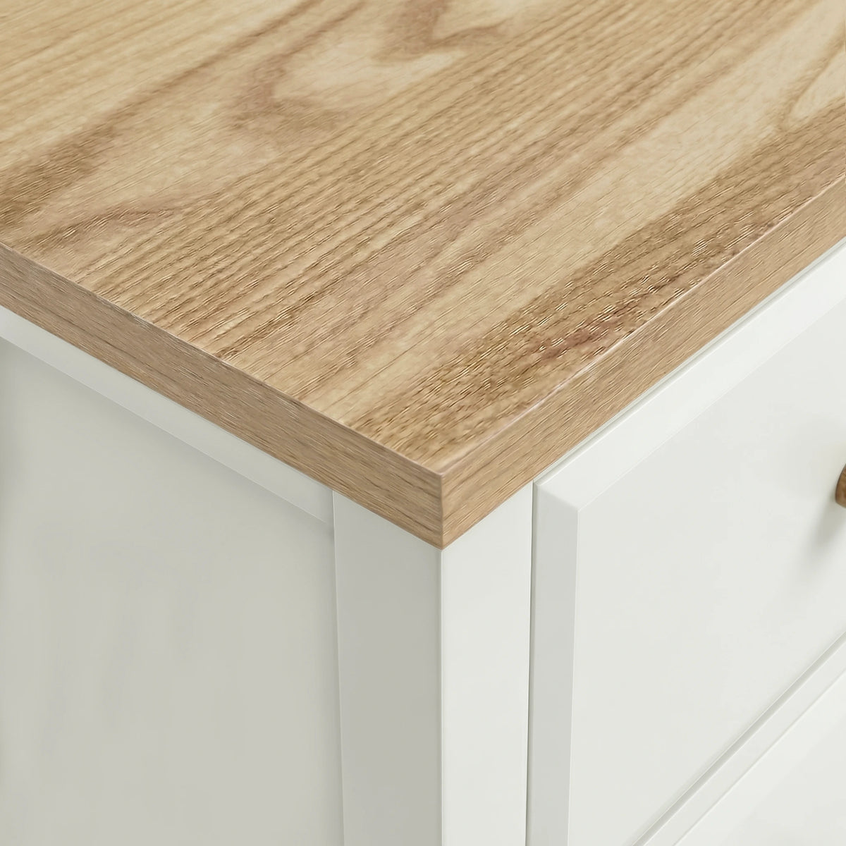 [White] Close-up of a wooden countertop on a white bedside table