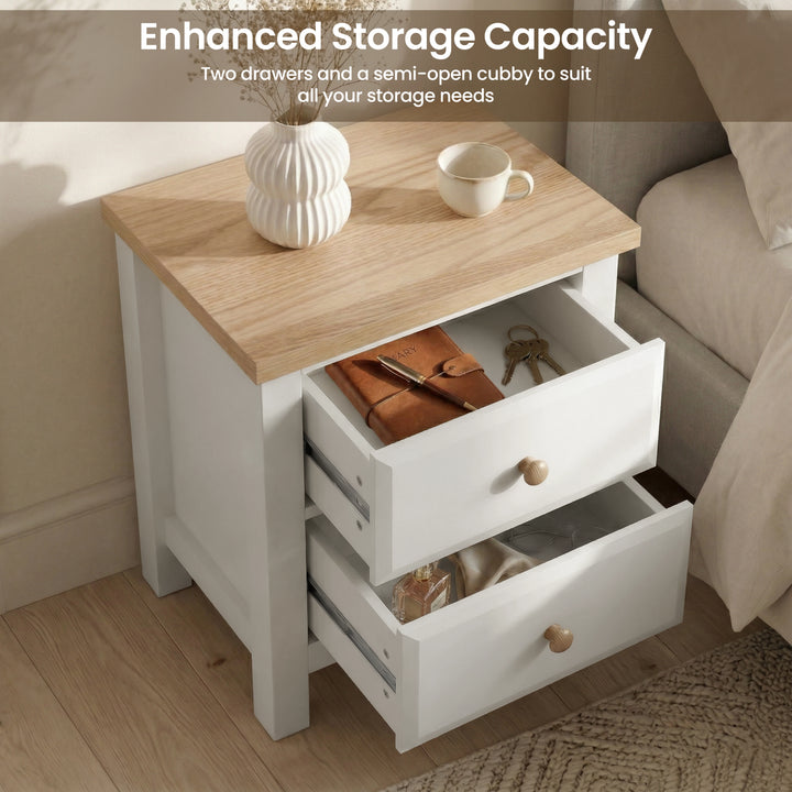 [White] Haven two drawer bedside in white with oak top, both drawers pulled open showing leather bag and shoes inside