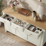 [White] Haven sideboard close view with drawers open, oak top, cosmetics, notebook, keys, and sunglasses.