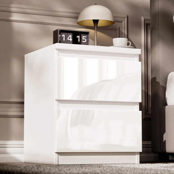 [White]  single white high gloss bedside table with two handleless drawers beside bed with lamp on top