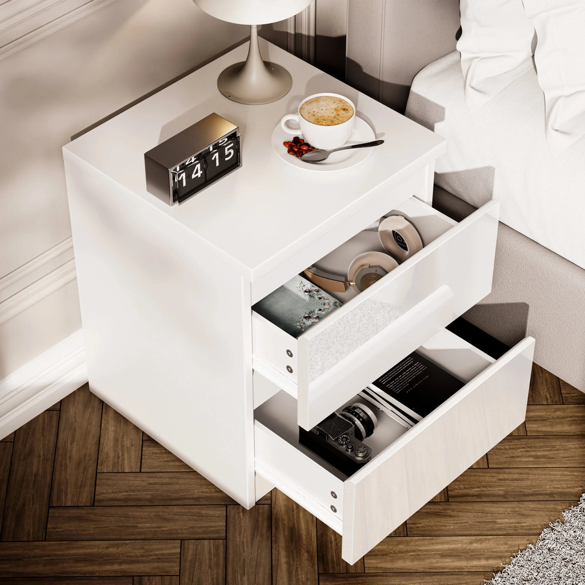 [White] high gloss bedside table from above with both drawers open showing headphones and books