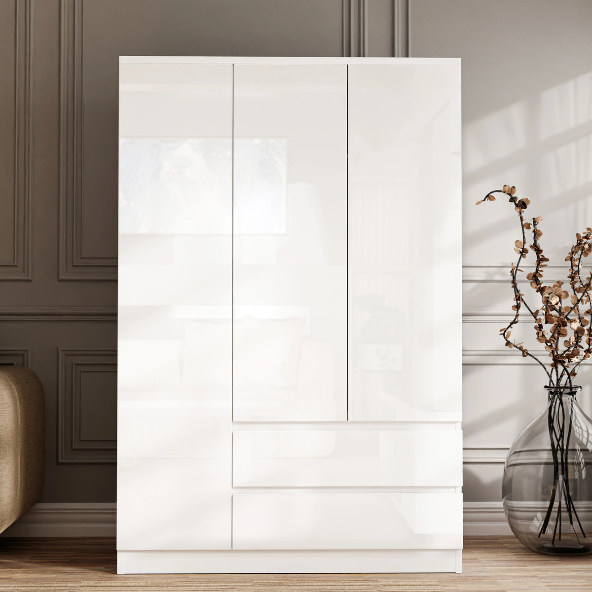 [White] Front view of high gloss 3 door wardrobe with drawers, three closed handleless doors above two stacked drawers