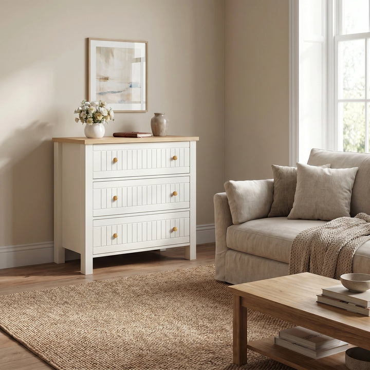 [White] Living room with a white dresser, gray sofa, and wooden coffee table