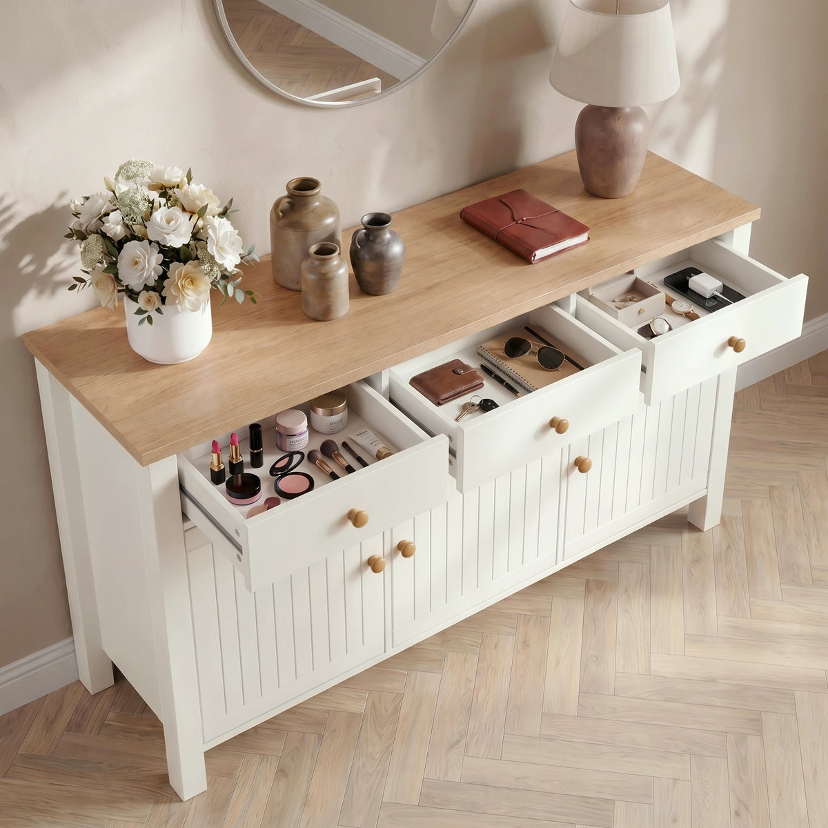 [White] Linra 3 door sideboard with three drawers open at an angle showing interior depth storing keys, and small accessories