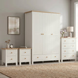 [White] Linra White Painted 4 Piece Bedroom Set arranged against a light grey wall two bedside tables