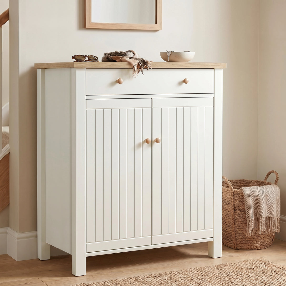 [White] Linra White 4 Tier Painted Shoe Storage Cabinet featuring a closed two-door slatted front design with a wooden top surface decorated with personal accessories in a bright hallway.