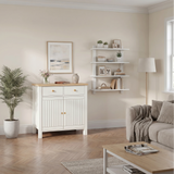 [White] Living room with white cabinet, sofa, coffee table, and shelves.