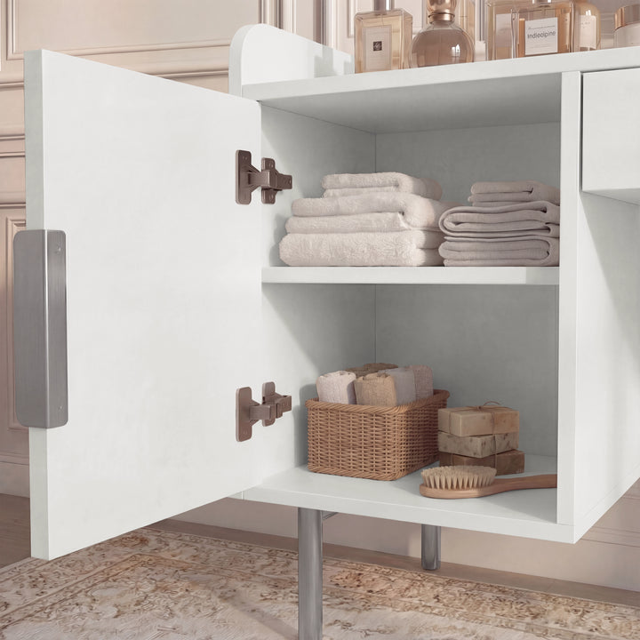 [White]  dressing vanity table with open shelves displaying neatly arranged storage baskets and towels