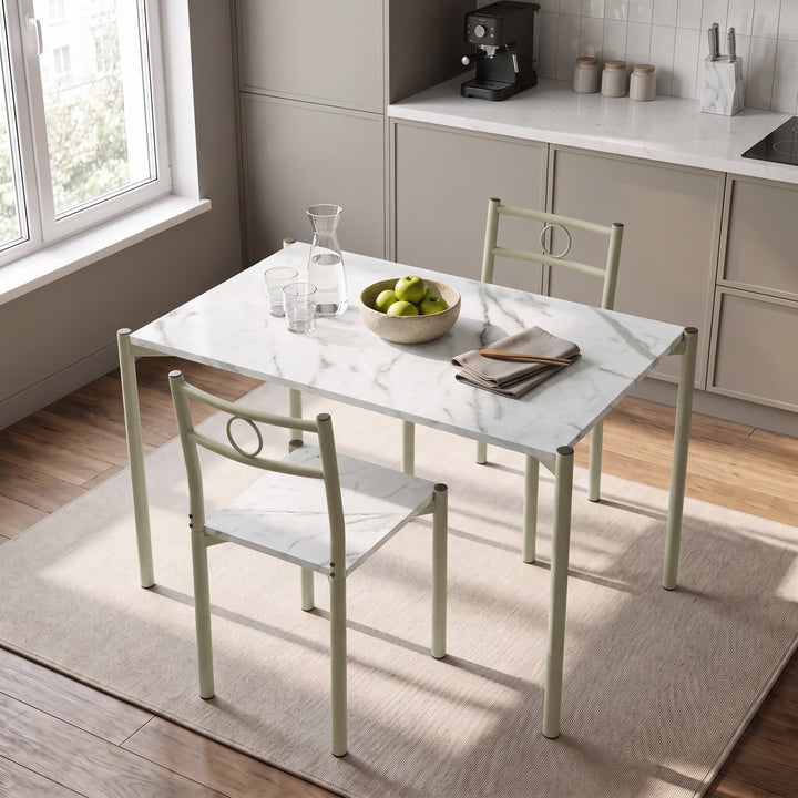 [White Marble] Kitchen breakfast scene with the table set for two, orange juice, glasses, apples, plates and cutlery
