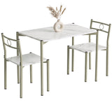 [White Marble] Angled studio view of the three-piece dining set with two chairs, circular backs, pale frames and a decorative vase