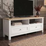 [White] Oskara White Painted TV Unit with Storage at a three-quarter angle showing the oak top surface, two open cubbies with media accessories, and paired shaker drawers