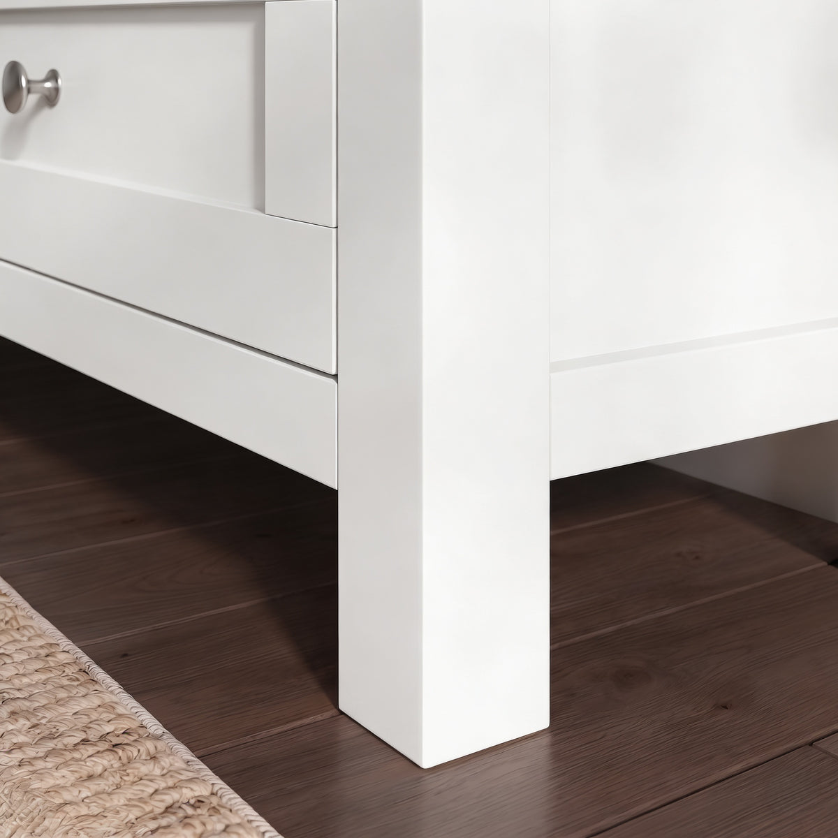 [White] Oskara White Painted TV Unit with Storage detail shot of the lower corner showing the solid square white painted leg, shaker drawer front
