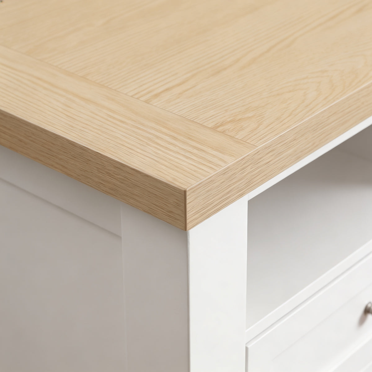 [White] Oskara White Painted TV Unit with Storage close-up corner detail of the natural oak top surface showing wood grain texture, mitred edge