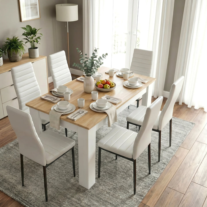 [6 Seater | White] White & Pine 4-6 Seater Dining Table and Chairs Set in an elevated side view showing six plates, individual cutlery settings, and a central fruit bowl