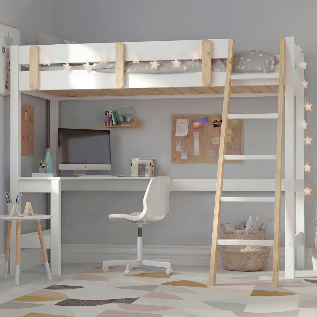 [White + Pine] Kids bunk bed with desk showing complete frame with star-print bedding on upper platform