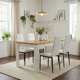 [4 Seater | White] Dining Table and Chairs Set with four white faux leather chairs around a pine-top table in a bright white panelled dining room