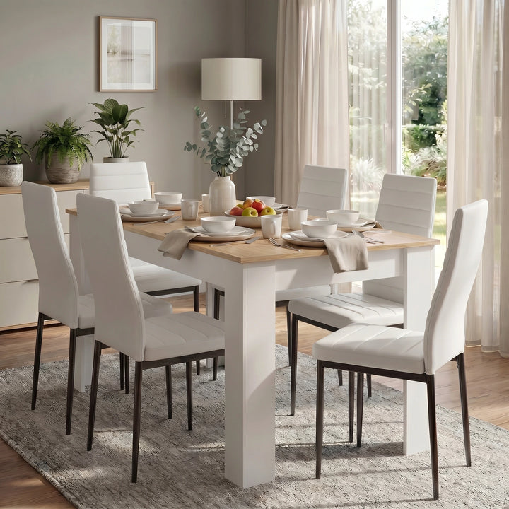 [6 Seater | White] White & Pine 4-6 Seater Dining Table and Chairs Set positioned next to a sunlit glass window in a contemporary home with neutral wall colors and houseplants