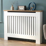 [Medium | White] Radiator Cover with oak top shelf styled with a vase, vintage radio, and sculptural decor against a teal wall
