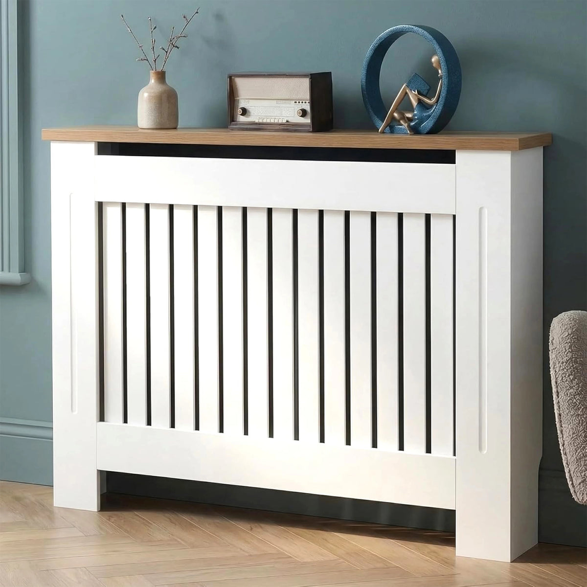 [Medium | White] Radiator Cover with oak top shelf styled with a vase, vintage radio, and sculptural decor against a teal wall