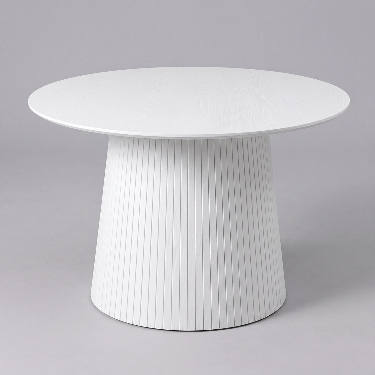 [White] 120cm round pedestal dining table with tapered slatted pedestal base in a studio shot