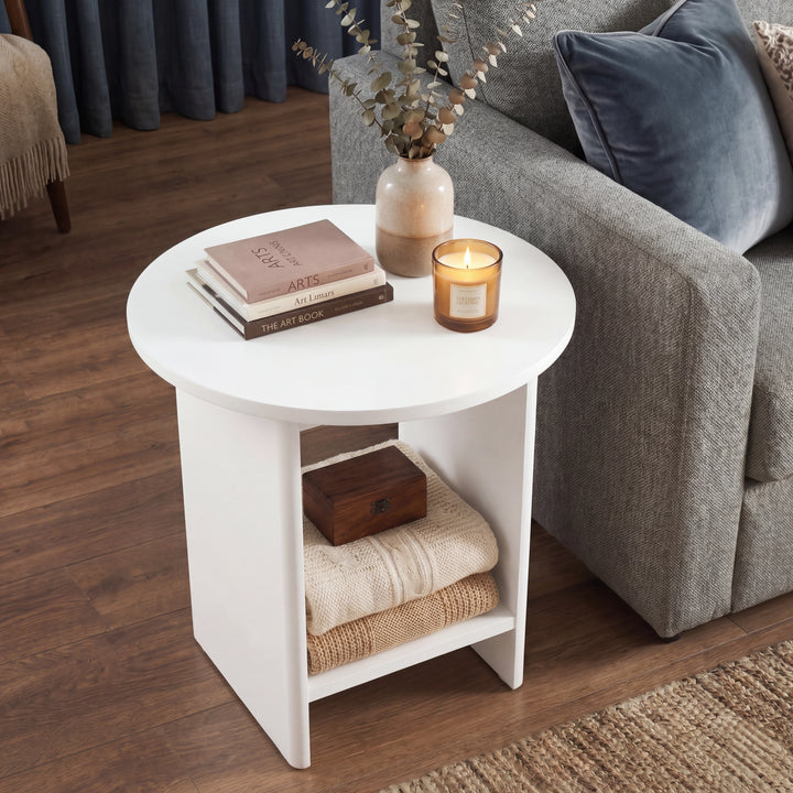 [White] Small Round Side Table with Shelf Living Room overhead angled view showing circular top surface with books and candle and lower shelf with folded throws