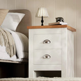 [White] white shaker 2 drawer bedside table side angle with throw on bed and panelled wall behind