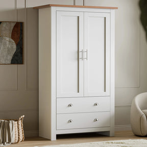 [White] Shaker double wardrobe with oak top, two panel doors and two cup-handle drawers, artwork on left