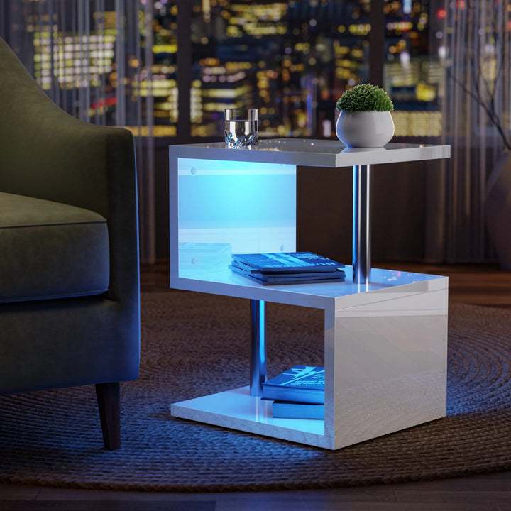[White] White high gloss side table angled night-time shot beside green chair with skyline of lit buildings
