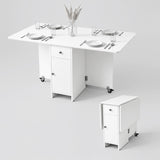 [White] Space saving folding dining table for four shown with opened leaves & shown compact with both leaves folded on wheels