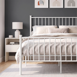 [White | Double] Metal bed front close-up view of white bar footboard, tall headboard, neutral bedding & centre support legs.