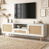 [White] Wovena TV unit angled lifestyle beneath wall-mounted TV with dried pampas, wooden figurine, and stacked books