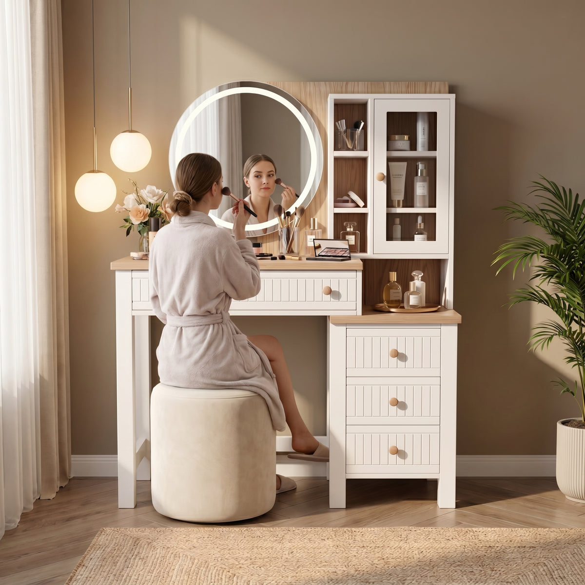 [White] Linra White Painted Dressing Table with LED Mirror and Storage with a woman sitting at the desk applying makeup.