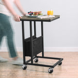 [Wooden Grey] movable side table being rolled on caster wheels with snacks and drink on tabletop