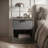 [Wooden Grey+Grey] Skova bedside table front view with grey drawer, open shelf, lamp and dried flower vase