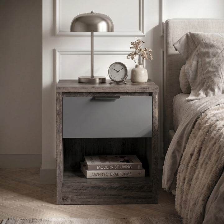 [Wooden Grey+Grey] Skova bedside table front view with grey drawer, open shelf, lamp and dried flower vase