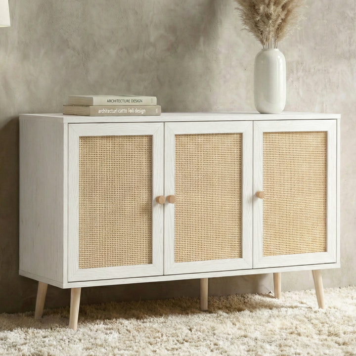 [White] Wovena Rattan 3 Door Sideboard - Adjustable Shelf White shown from an angled perspective in a styled room layout.