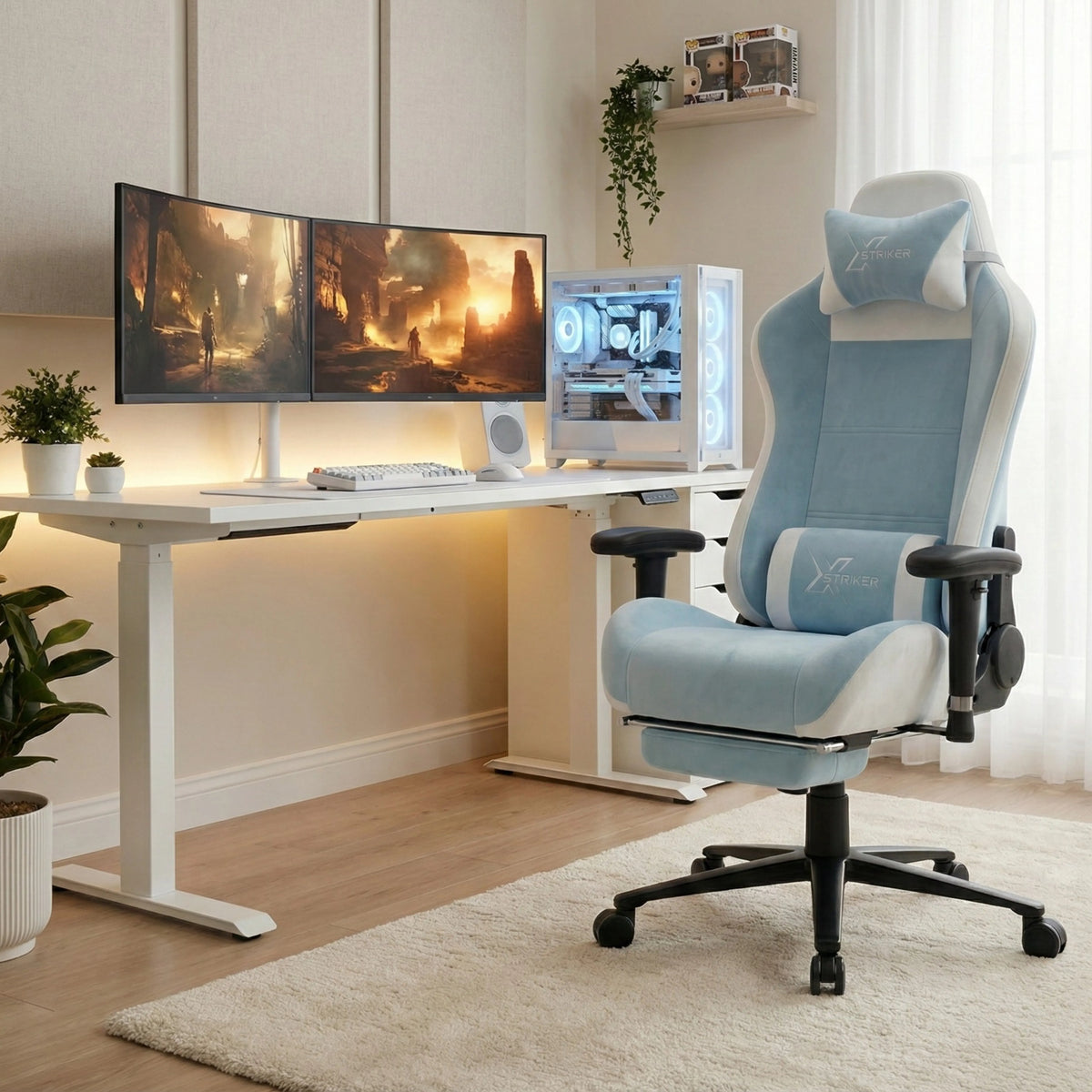 [Blue] Xstriker Velvet Gaming Chair with Footrest in light blue and white, placed in a modern gaming setup with dual monitors and a white PC case.