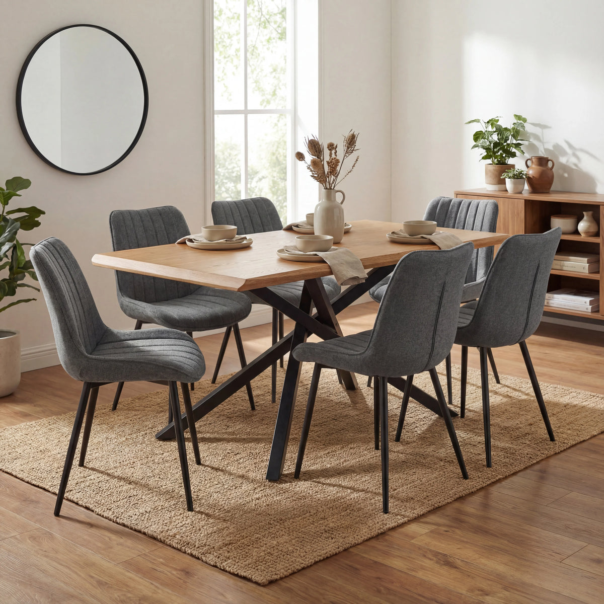 [6 Seater | Grey] Six grey Xylon dining chairs at oak table with black metal cross base and place settings